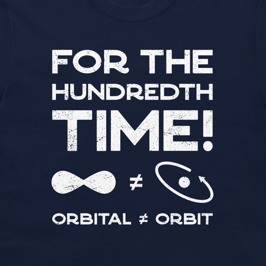 A close-up of a navy blue t-shirt featuring a distressed white graphic print that reads 'FOR THE HUNDRETH TIME!' with an infinity symbol, a non-equal sign, and an orbit symbol, concluding with 'ORBITAL ≠ ORBIT'.
