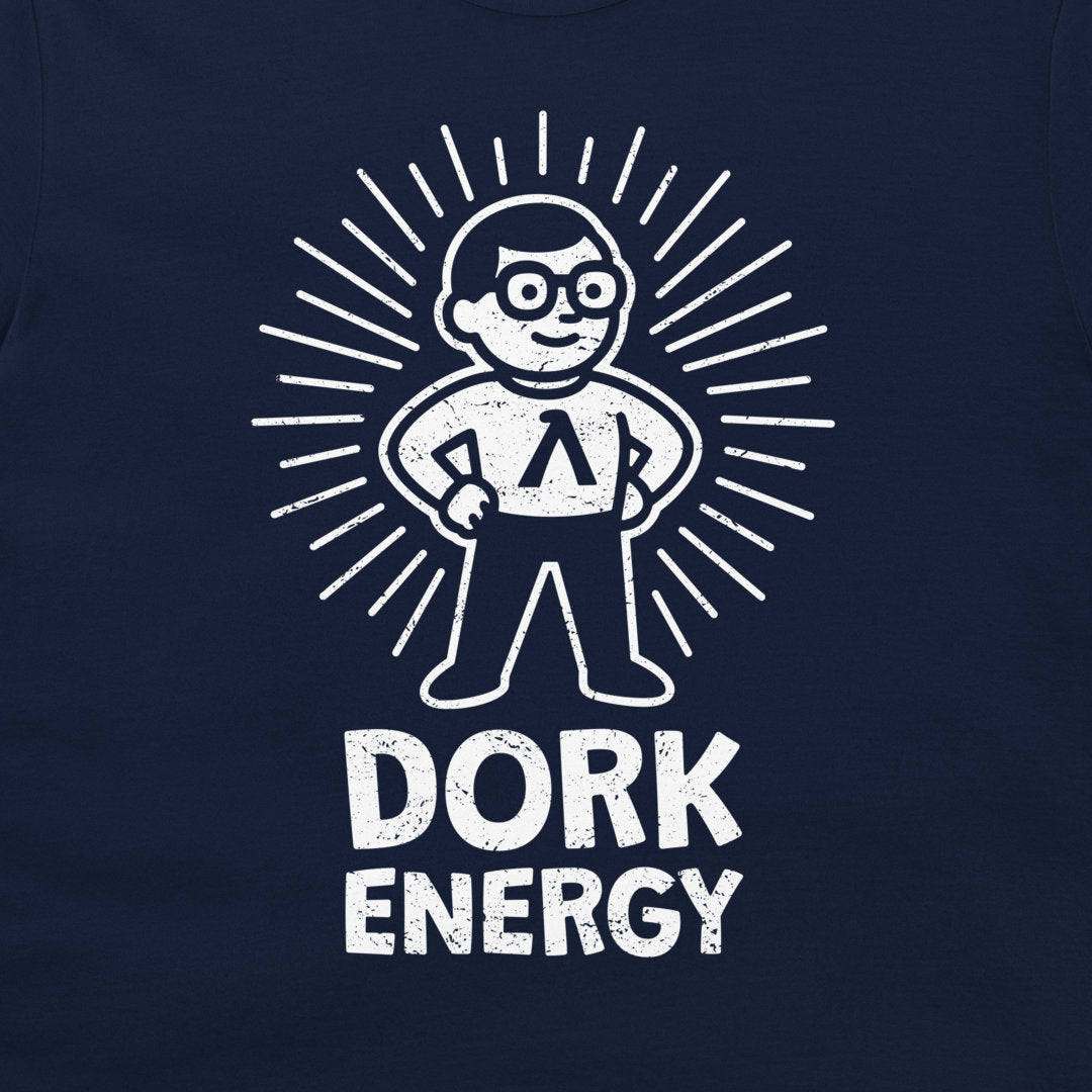 A close-up of a navy blue t-shirt featuring a white distressed graphic of a cartoon character with glasses and a Lambda symbol on the chest, surrounded by radiating lines, with the text 'DORK ENERGY' printed below.