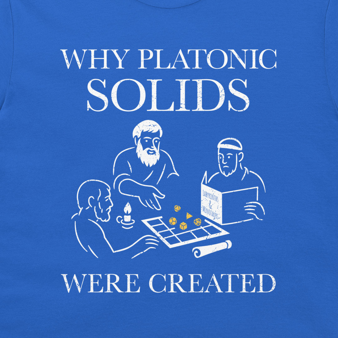 A close-up of a royal blue t-shirt featuring a white graphic print with the text 'WHY PLATONIC SOLIDS WERE CREATED' and a line-art illustration of three philosophers playing with dice.
