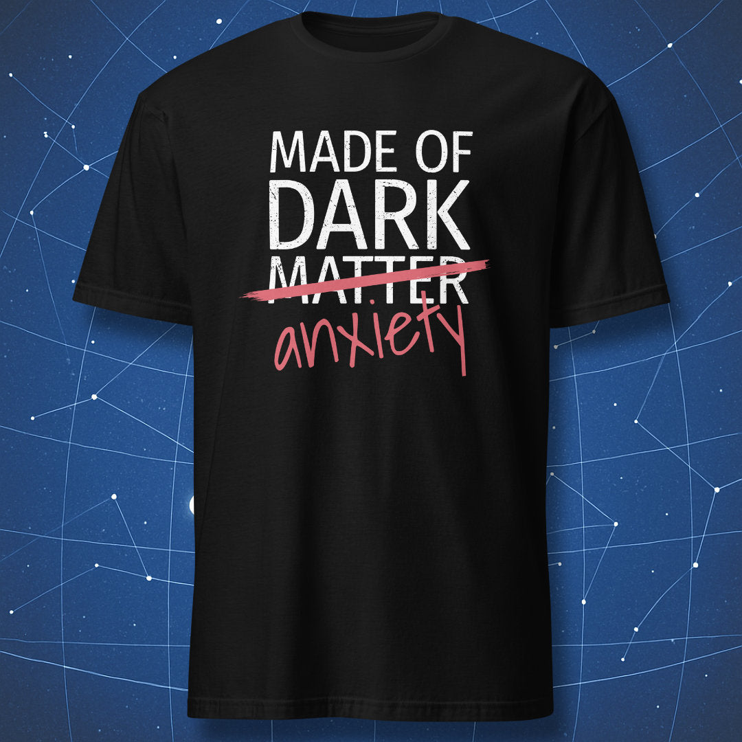 Made of Dark Matter Anxiety T-shirt – funny science and mental health design with crossed-out text, white and red print on black shirt.
