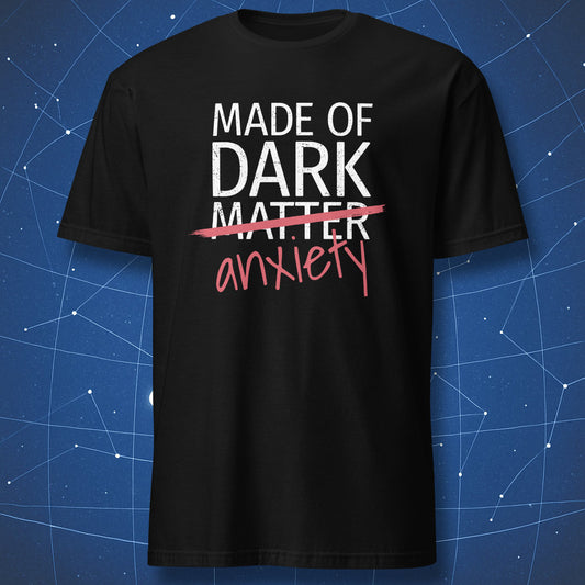 Made of Dark Matter Anxiety T-shirt – funny science and mental health design with crossed-out text, white and red print on black shirt.