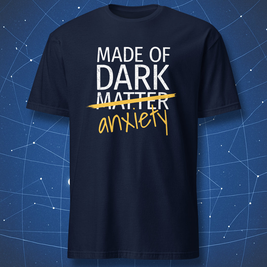 Made of Dark Matter Anxiety T-shirt – humorous science-themed design with yellow handwritten ‘anxiety,’ white print on navy shirt.