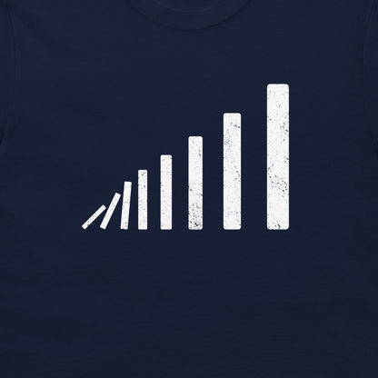 A close-up of a domino effect perspective T-shirt – white minimalist domino bars forming depth illusion, printed on navy shirt.