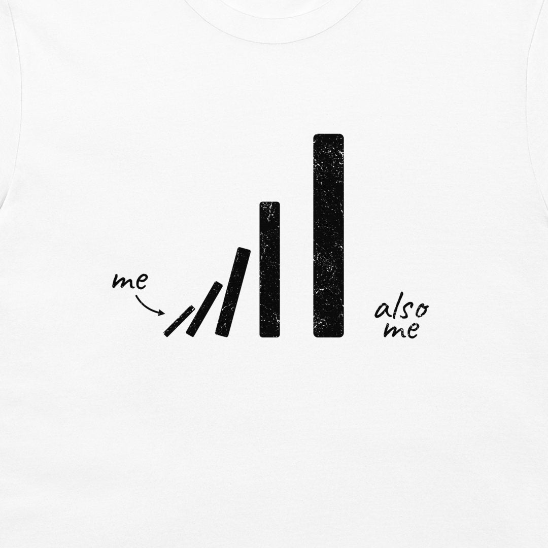 White long-sleeve t-shirt featuring a black distressed graphic of falling dominoes with the handwritten words 'me' and 'also me'.