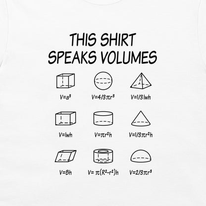 A white graphic t-shirt featuring a black printed design that reads 'THIS SHIRT SPEAKS VOLUMES' above nine different 3D geometric shapes with their volume formulas.