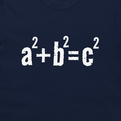 A close-up of a navy blue garment, likely a t-shirt, featuring the mathematical equation 'a² + b² = c²' printed in a distressed white font across the chest.