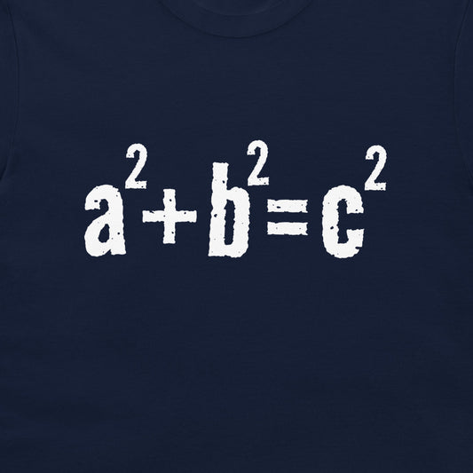 A close-up of a navy blue garment, likely a t-shirt, featuring the mathematical equation 'a² + b² = c²' printed in a distressed white font across the chest.