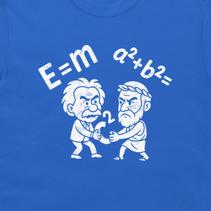 A close-up of a royal blue t-shirt featuring a white graphic print. The design shows a cartoon depiction of Albert Einstein and Pythagoras fighting over 'c²', with the equations 'E=m' and 'a²+b²=' printed above them in a distressed white font.