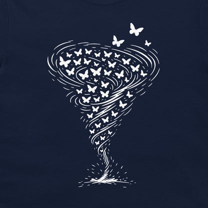 A close-up of a navy blue t-shirt, featuring a white graphic print of a tornado made of swirling lines and butterflies.
