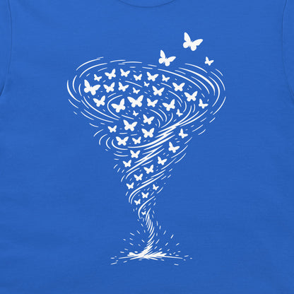A close-up of a royal blue t-shirt, featuring a white graphic print of a tornado made of swirling lines and numerous small butterflies.