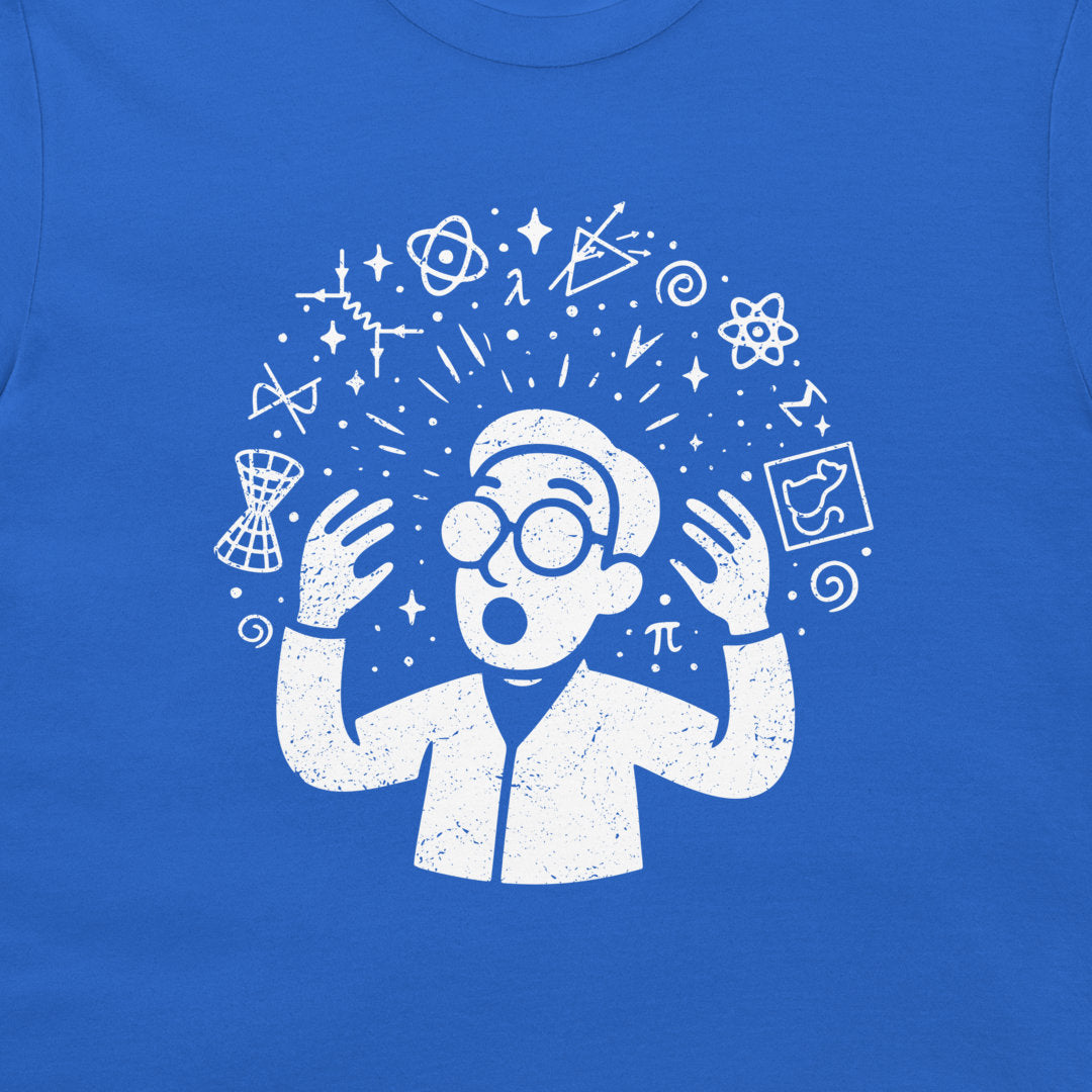 A close-up of a royal blue t-shirt featuring a white distressed graphic of a scientist with glasses and lab coat surrounded by science symbols like atoms, a telescope, and a pi symbol.