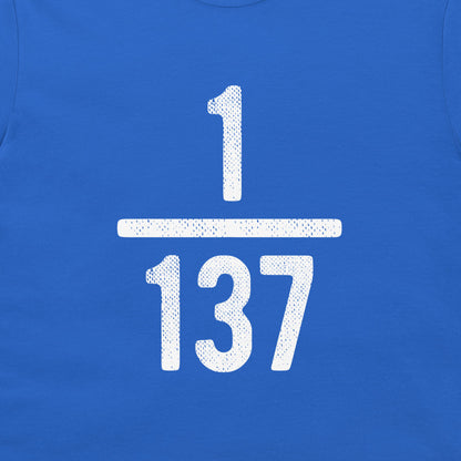 A close-up of a royal blue t-shirt, featuring a large white distressed graphic of the fraction 1/137 on the front.