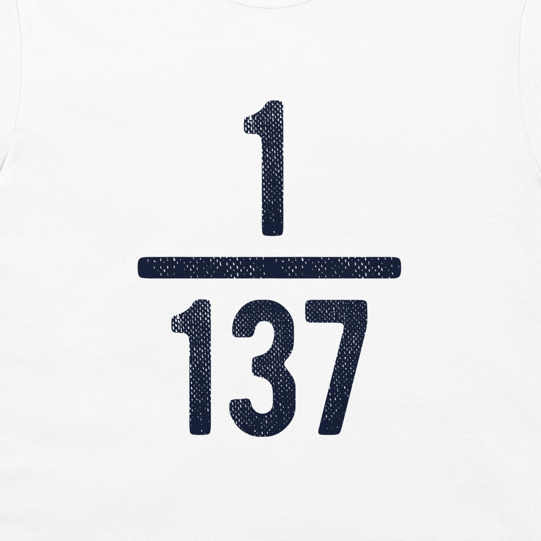 A close-up of a white tank top or t-shirt, featuring a dark navy blue graphic of the fraction 1/137 printed on the chest.