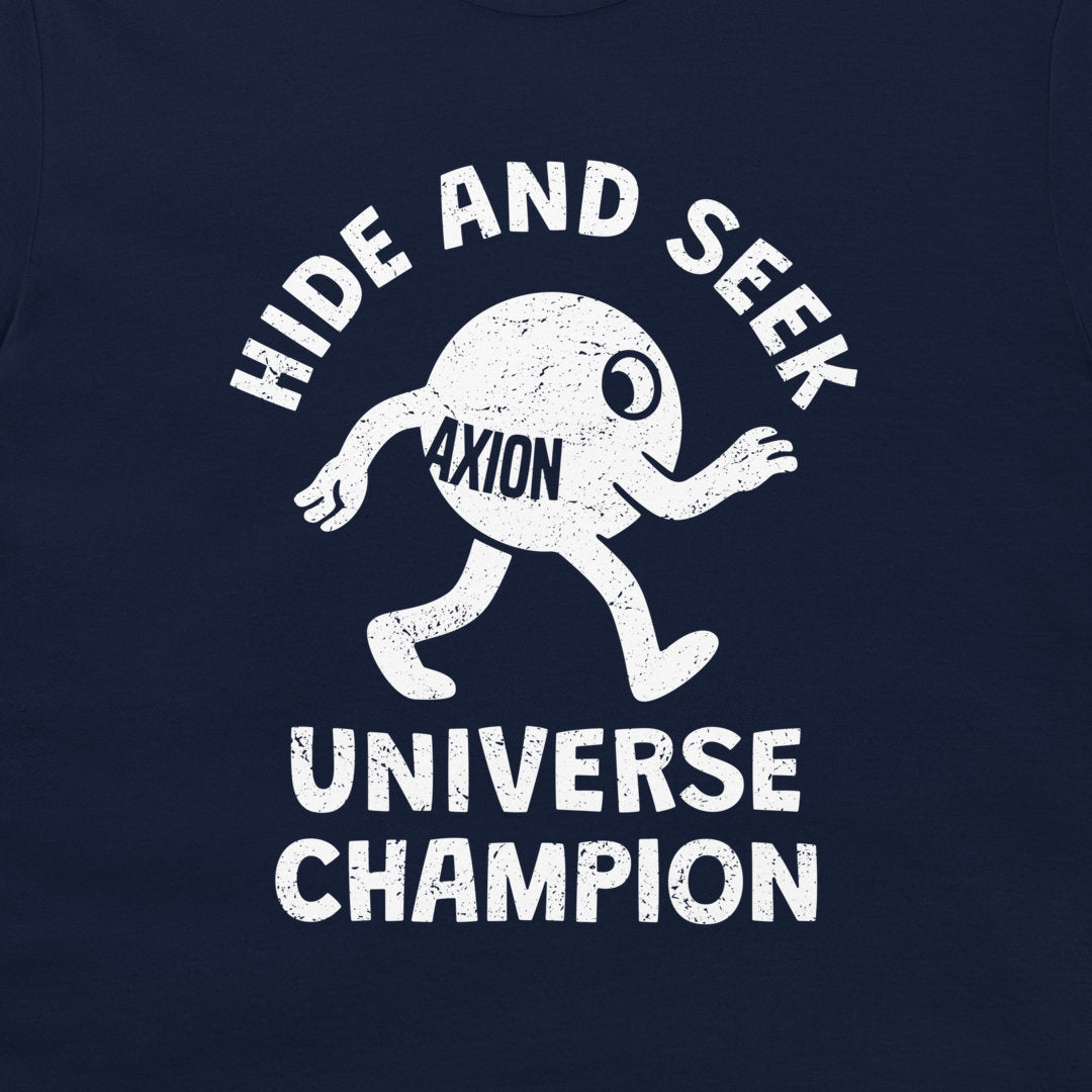 A close-up of a navy blue t-shirt featuring a distressed white graphic of a cartoon character with the text 'HIDE AND SEEK' above and 'UNIVERSE CHAMPION' below, with 'AXION' printed on the character's torso.