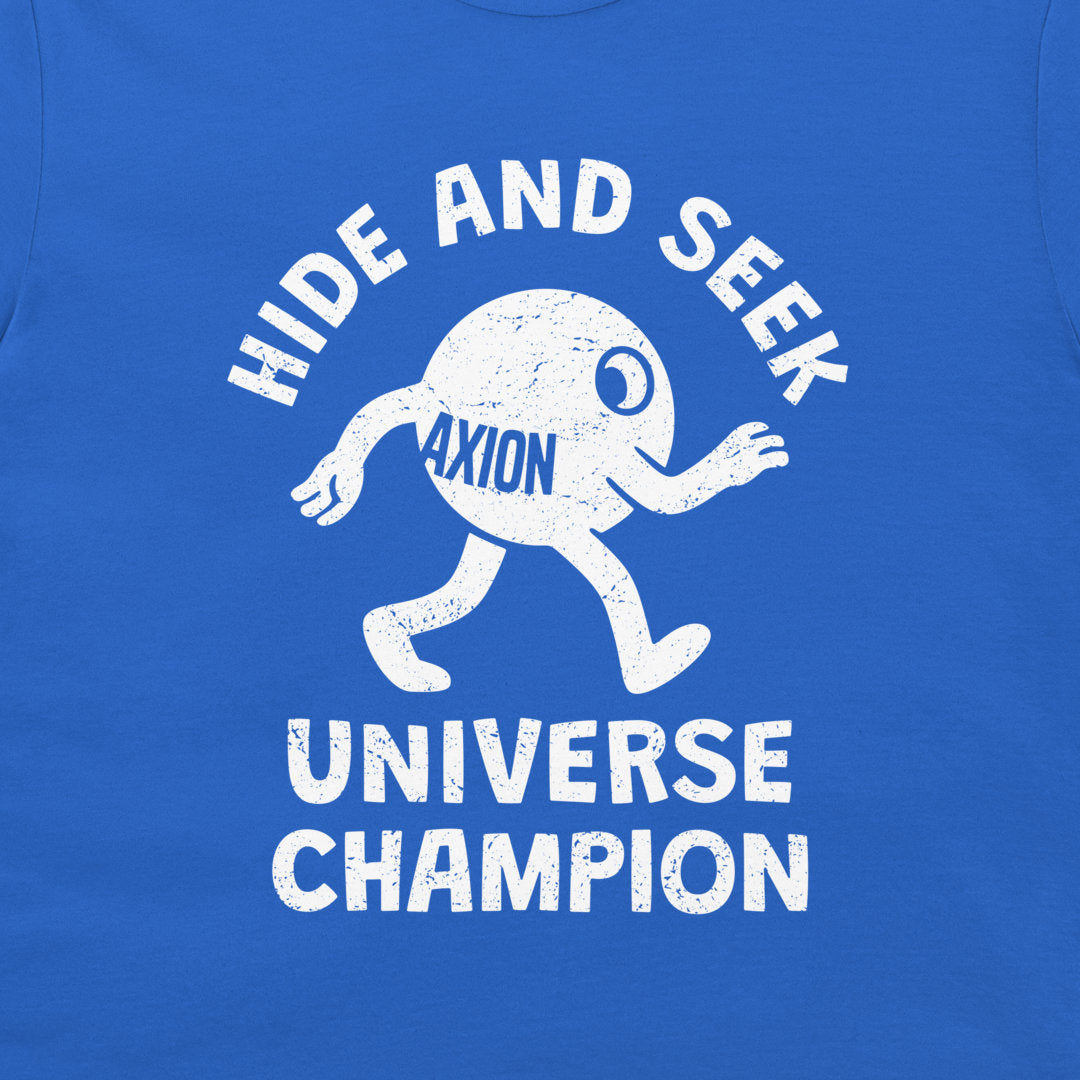 A close-up of a blue t-shirt featuring a white distressed graphic of a cartoon character with the text 'HIDE AND SEEK' above and 'UNIVERSE CHAMPION' below, with 'AXION' printed on the character.