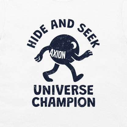 A close-up of a white t-shirt, featuring a distressed navy blue graphic print. The design shows a cartoon character with the word 'AXION' on its chest, surrounded by the text 'HIDE AND SEEK' above and 'UNIVERSE CHAMPION' below.