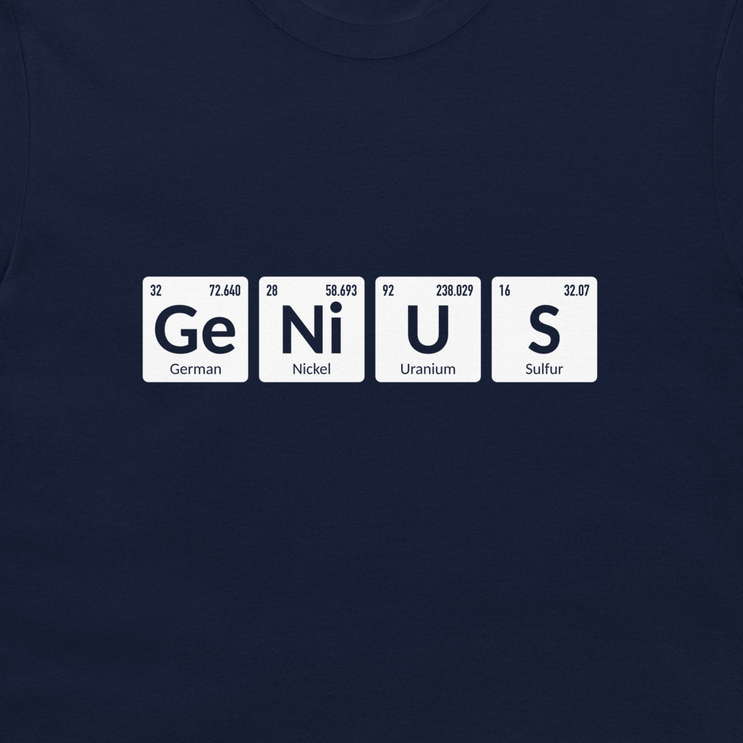 A close-up of a navy blue t-shirt featuring a graphic of four white periodic table tiles spelling out 'GENIUS' (German, Nickel, Uranium, Sulfur).