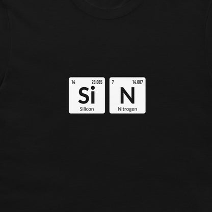 A close-up of a black t-shirt featuring a graphic print of two white periodic table tiles spelling out 'SiN' with 'Silicon' and 'Nitrogen' written underneath.