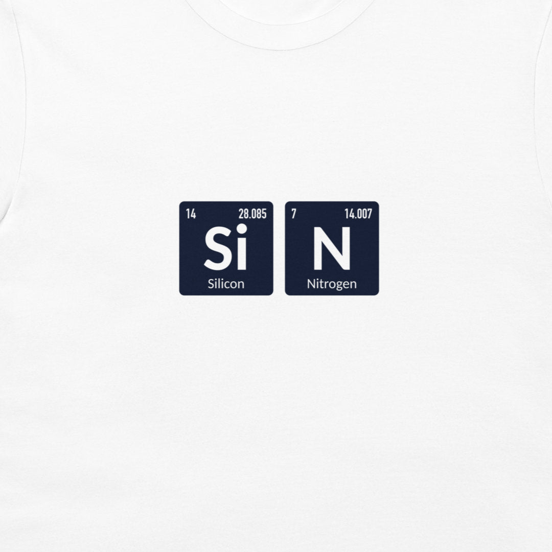 A close-up of a white t-shirt featuring a graphic print of two white periodic table tiles spelling out 'SiN' with 'Silicon' and 'Nitrogen' written underneath.