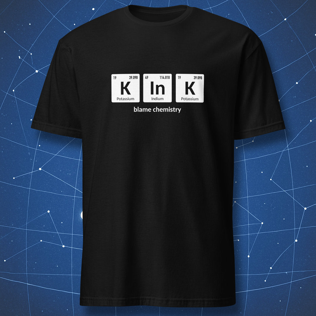 Black T-shirt featuring periodic table pun K–In–K with Potassium, Indium, and Potassium elements and text ‘blame chemistry’.