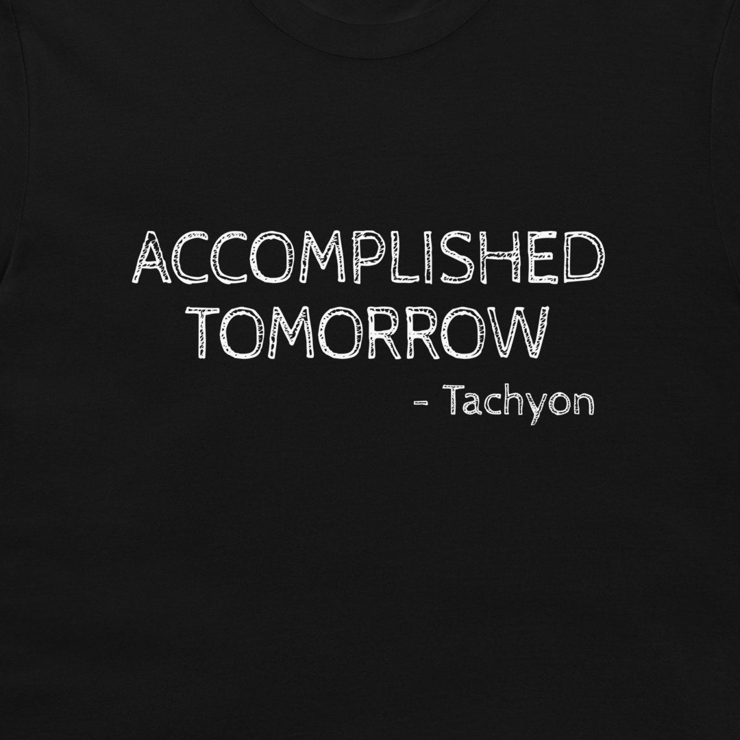 A close-up of a black t-shirt featuring the text 'ACCOMPLISHED TOMORROW - Tachyon' printed in a white, chalk-like distressed font.