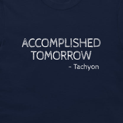 A close-up of a navy blue t-shirt featuring the text 'ACCOMPLISHED TOMORROW - Tachyon' printed in a white, distressed font on the chest.