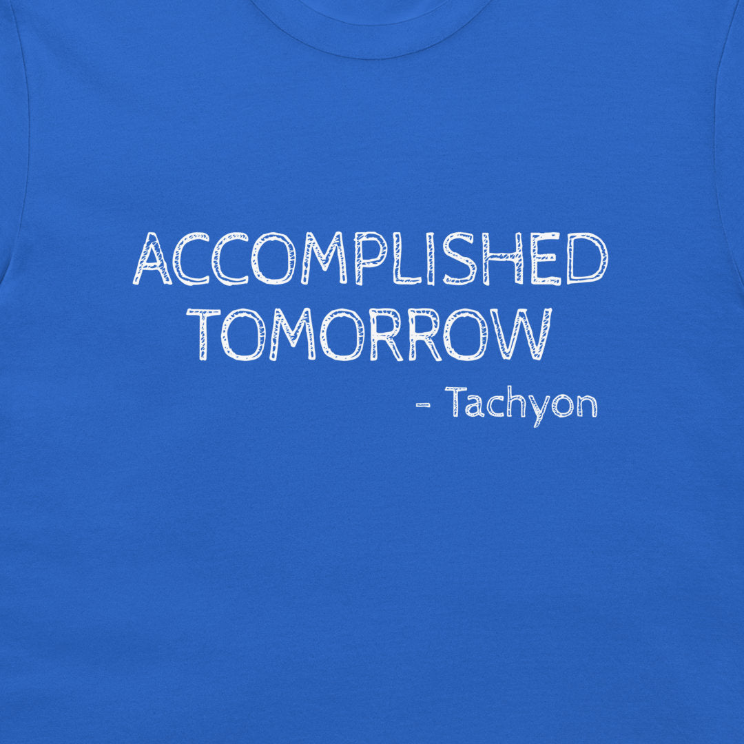 A close-up of a royal blue t-shirt featuring the text 'ACCOMPLISHED TOMORROW - Tachyon' printed in a white, distressed font across the chest.