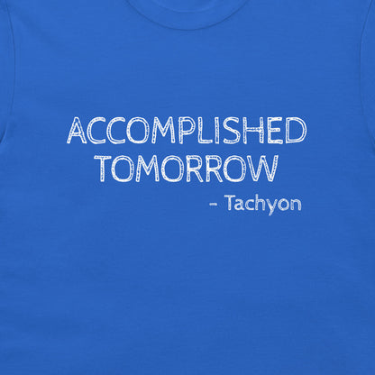 A close-up of a royal blue t-shirt featuring the text 'ACCOMPLISHED TOMORROW - Tachyon' printed in a white, distressed font across the chest.