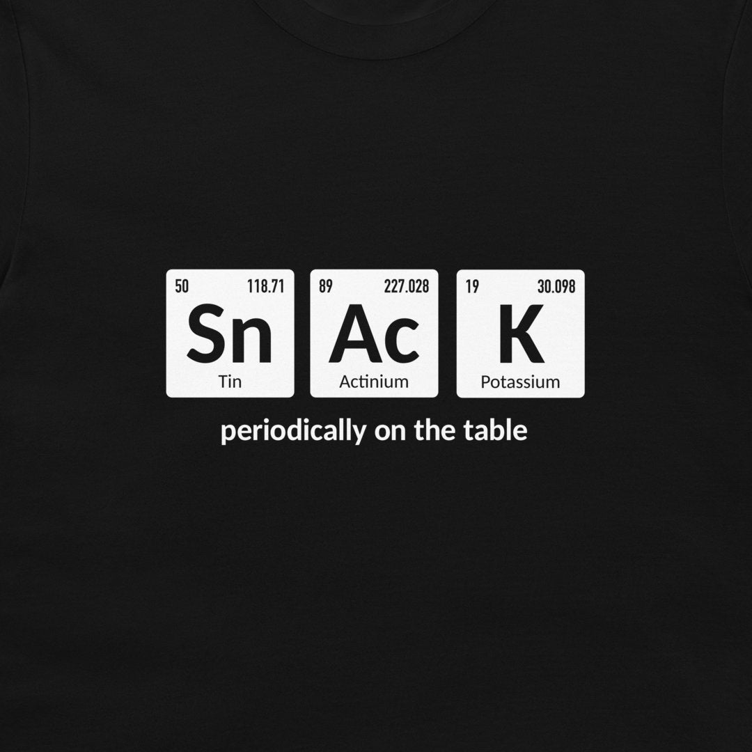 A black crewneck t-shirt featuring a white periodic table graphic that spells out 'SnAcK' with the phrase 'periodically on the table' underneath.