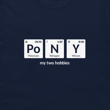 A close-up of a navy blue t-shirt featuring a white graphic that spells 'PoNY' using periodic table style tiles, with 'my two hobbies' printed below.
