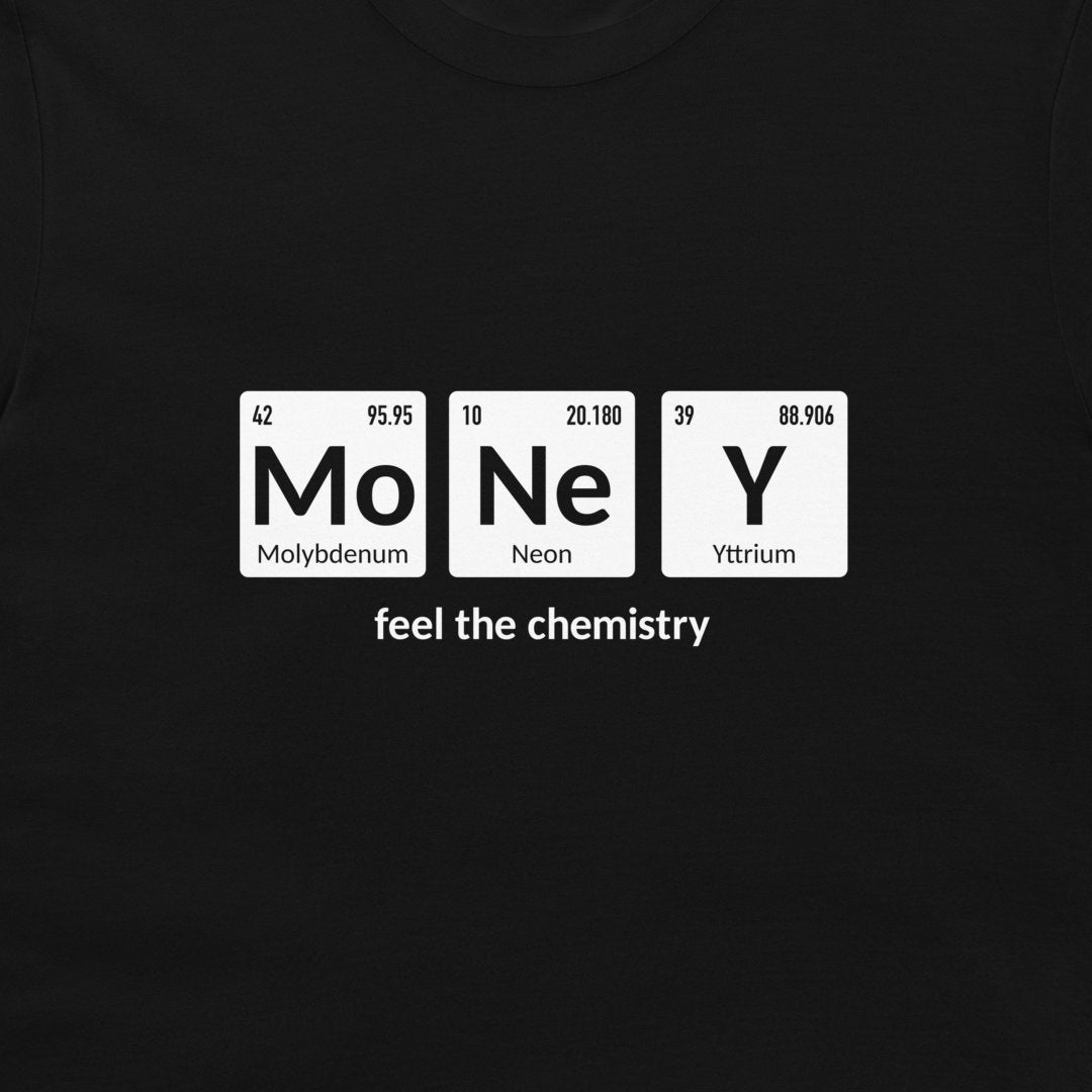 A close-up of a black t-shirt, featuring a white graphic print of three periodic table style tiles spelling 'MoNeY' with the phrase 'feel the chemistry' underneath.