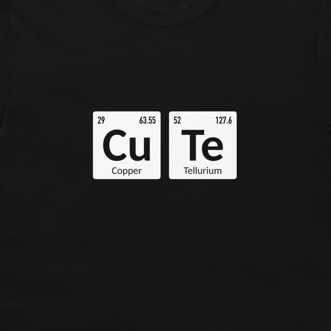 A close-up of a black t-shirt, featuring a white graphic print of two periodic table style tiles spelling out 'CuTe' with 'Copper' and 'Tellurium' written underneath.