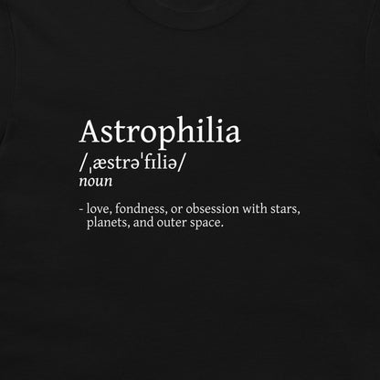 A close-up of a black t-shirt featuring a white printed dictionary-style definition of the word 'Astrophilia' on the chest.