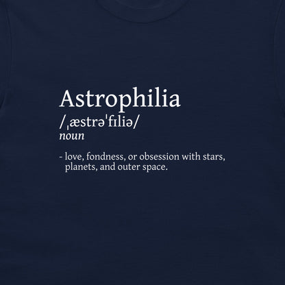 A close-up of a navy blue t-shirt featuring a white printed dictionary-style definition for the word 'Astrophilia'.