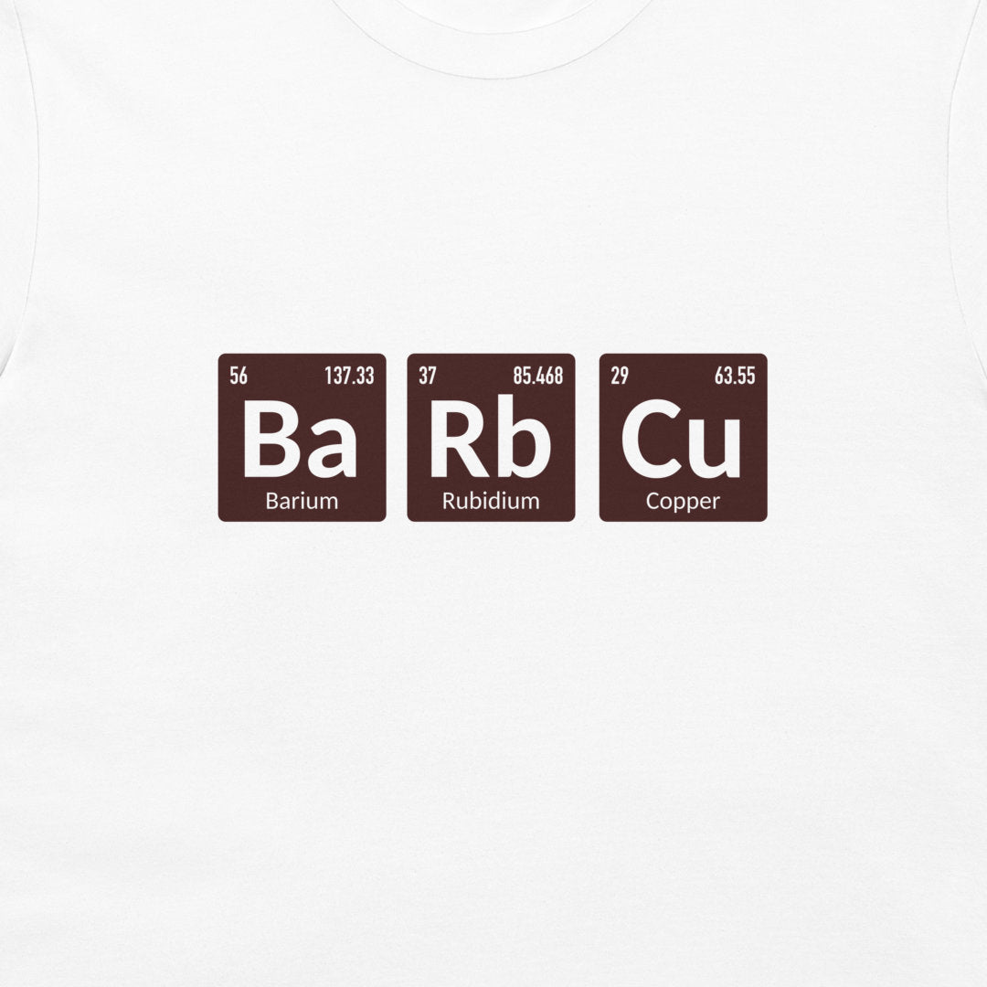 A white crewneck t-shirt featuring a graphic print of three periodic table style tiles spelling out 'Ba Rb Cu' in white text on dark brown squares.