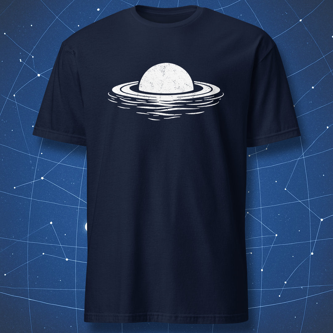 White Saturn planet floating illustration on navy blue t-shirt