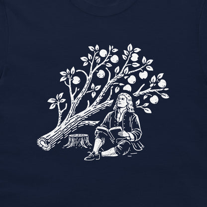 A navy blue t-shirt featuring a white graphic print of a Isaac Newton sitting by the cut down apple tree.