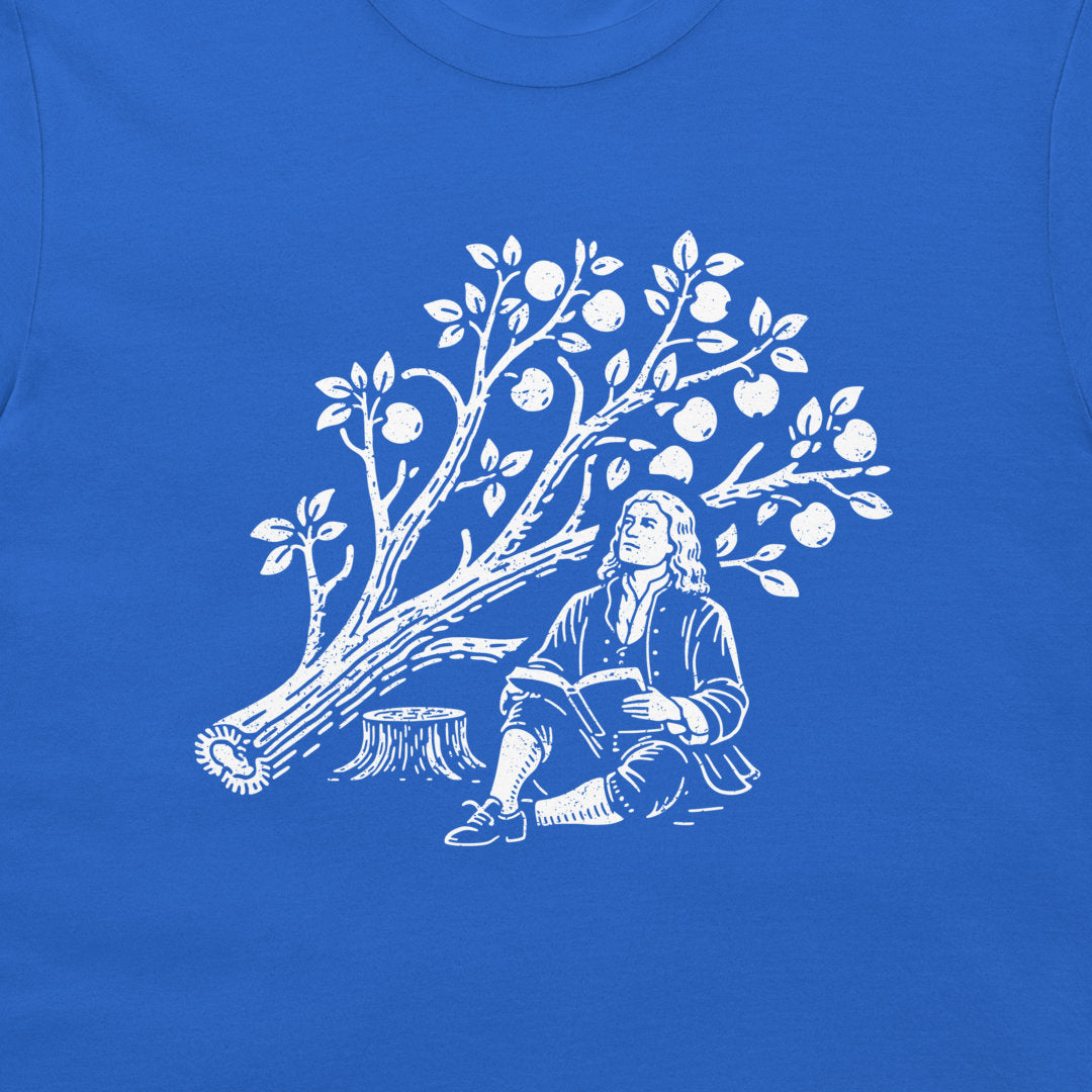A close-up of a royal blue garment, likely a t-shirt, featuring a white graphic print of a Isaac Newton sitting by the cut down apple tree.