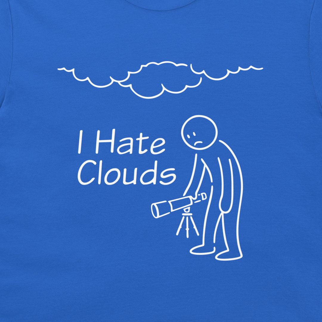 A close-up of a blue T-shirt featuring a white line-art graphic of a person holding a telescope under a cloud, with the text 'I Hate Clouds' printed on the chest.