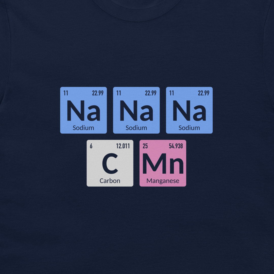 A dark navy blue t-shirt featuring a graphic print of periodic table elements spelling out 'Na Na Na C Mn' in light blue, white, and pink tiles.