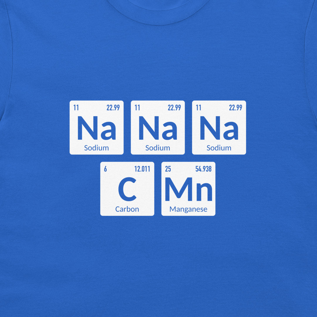 A close-up of a royal blue t-shirt featuring a graphic design of five white periodic table style tiles spelling out 'Na Na Na C Mn' in blue text, with 'Sodium', 'Carbon', and 'Manganese' written below each tile.