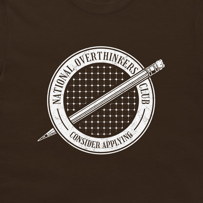 A close-up of a dark brown t-shirt featuring a white distressed graphic of a pencil inside a circular emblem that reads 'NATIONAL OVERTHINKERS CLUB' and 'CONSIDER APPLYING'.