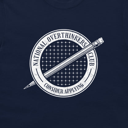 A close-up of a navy blue t-shirt, featuring a white circular graphic print with a pencil and the text 'NATIONAL OVERTHINKERS CLUB' and 'CONSIDER APPLYING'.