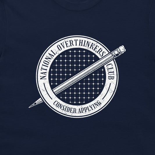 A close-up of a navy blue t-shirt, featuring a white circular graphic print with a pencil and the text 'NATIONAL OVERTHINKERS CLUB' and 'CONSIDER APPLYING'.