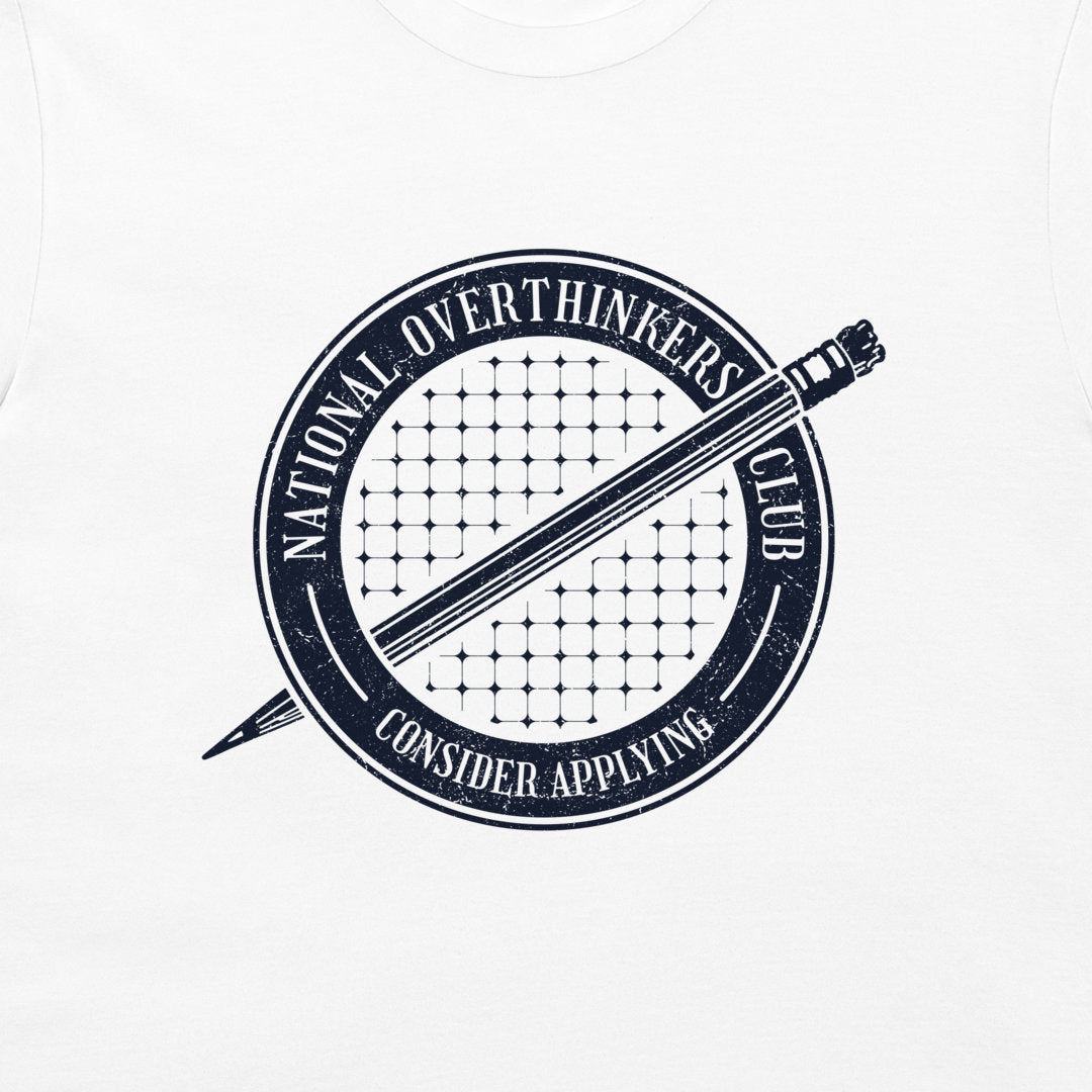 A close-up of a white garment, likely a t-shirt, featuring a distressed navy blue circular graphic with a pencil and the text 'National Overthinkers Club' and 'Consider Applying'.