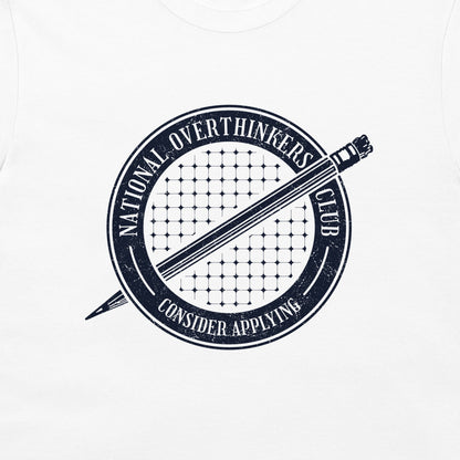 A close-up of a white garment, likely a t-shirt, featuring a distressed navy blue circular graphic with a pencil and the text 'National Overthinkers Club' and 'Consider Applying'.