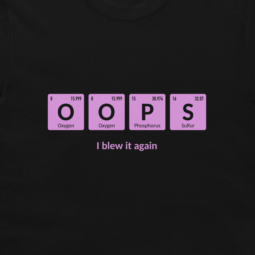 A black t-shirt featuring a graphic of four pink periodic table style tiles spelling 'OOPS' with 'I blew it again' printed in white text underneath.