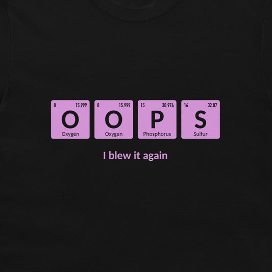 A black t-shirt featuring a graphic of four pink periodic table style tiles spelling 'OOPS' with 'I blew it again' printed in white text underneath.