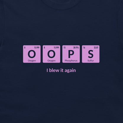 A dark navy blue t-shirt featuring a graphic of four pink periodic table style tiles spelling 'OOPS' with 'I blew it again' printed in white text underneath.