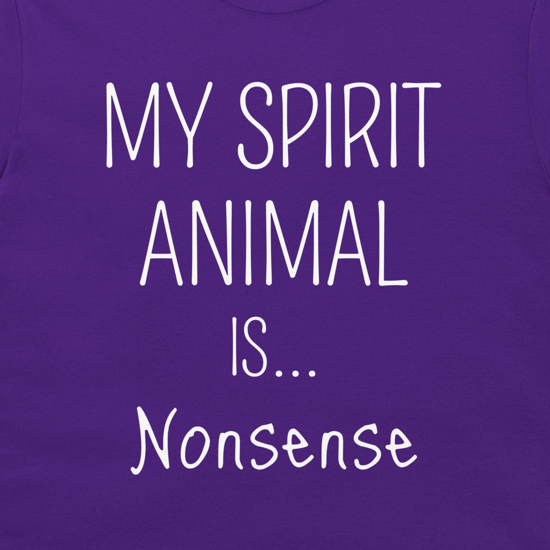A close-up of a purple garment, likely a t-shirt, featuring the text 'MY SPIRIT ANIMAL IS.
